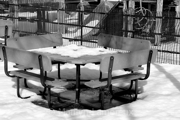 Snow-covered picnic table